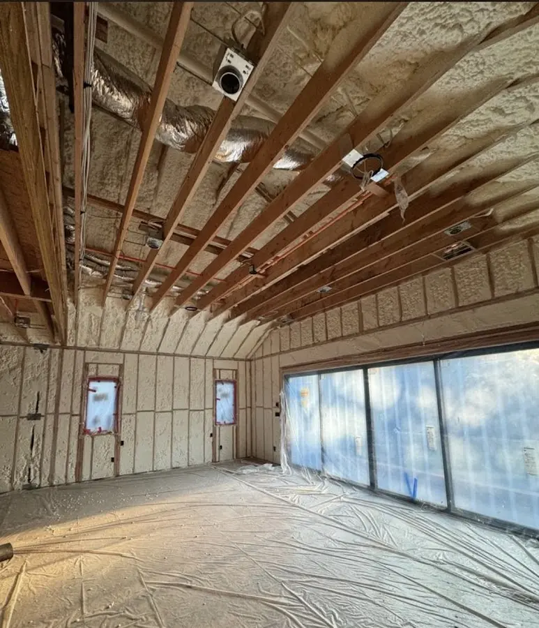 Interior walls and ceiling insulated with spray foam during new construction in Glenville
